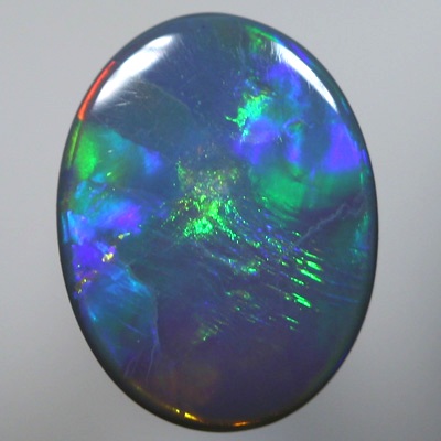 SOLID SEMI BLACK OPAL Large rolling flashes, neon orange to green